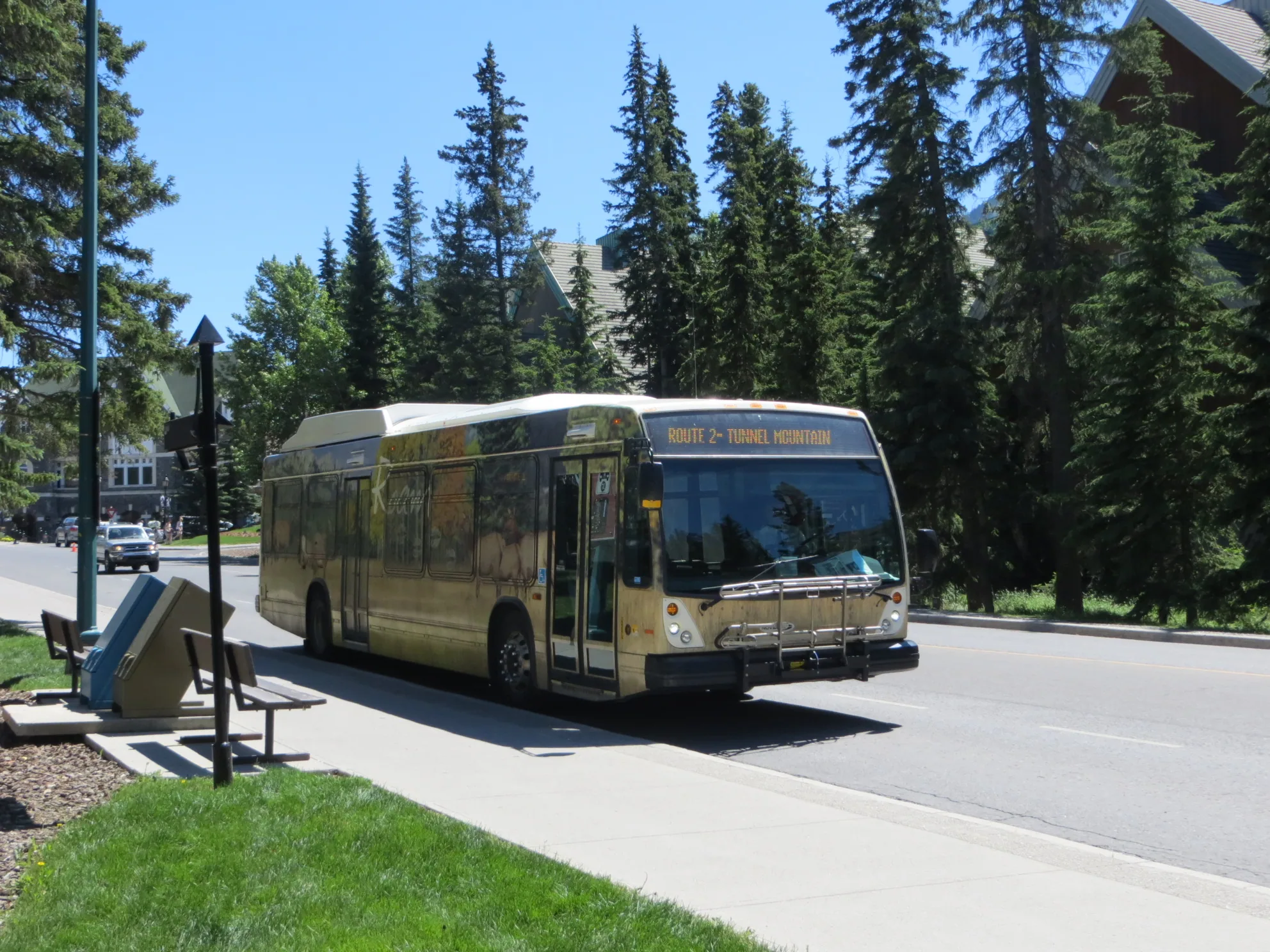 A Roam Transit bus travelling through Banff.