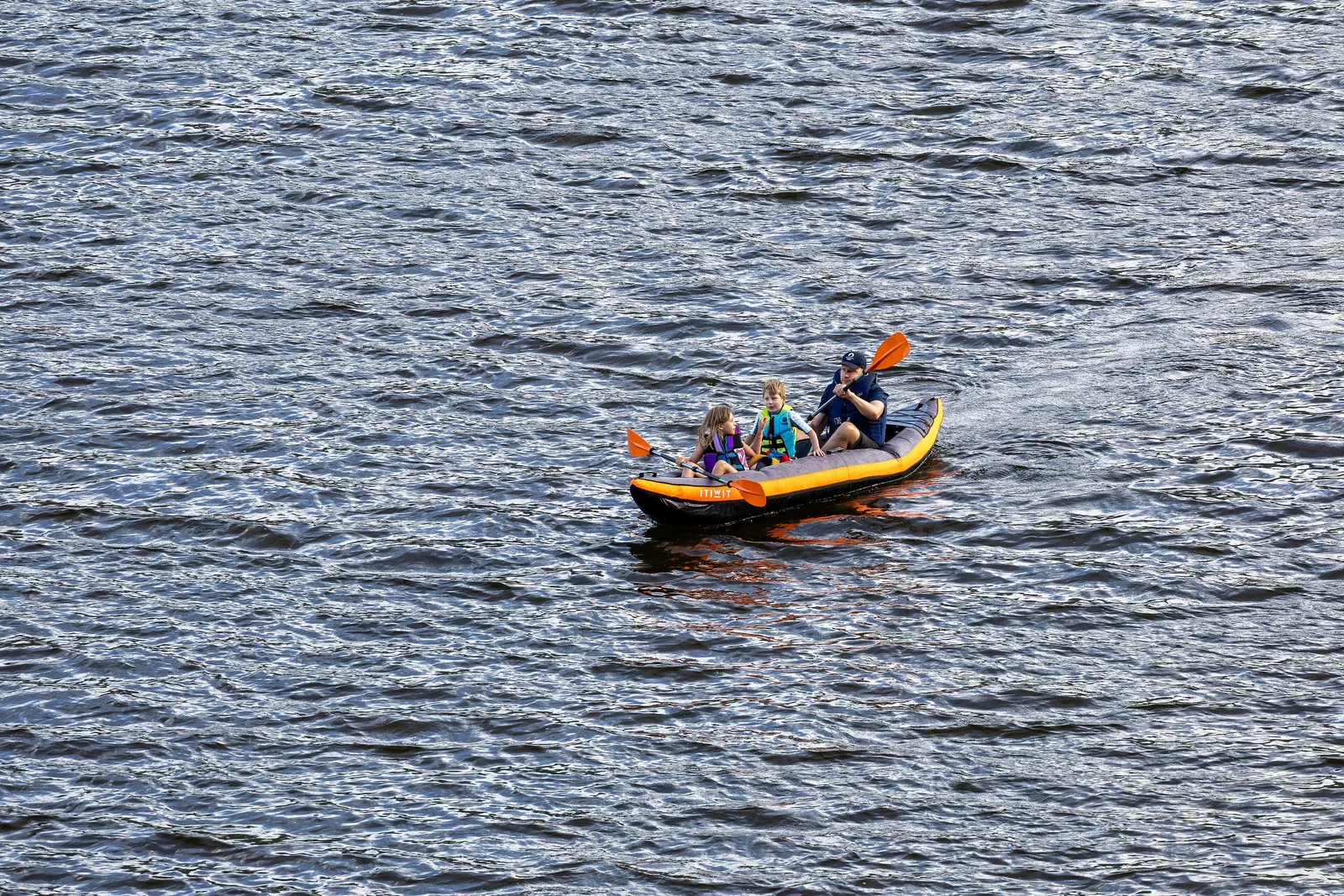 Canoers paddling the Vermilion Lakes below Mount Rundle